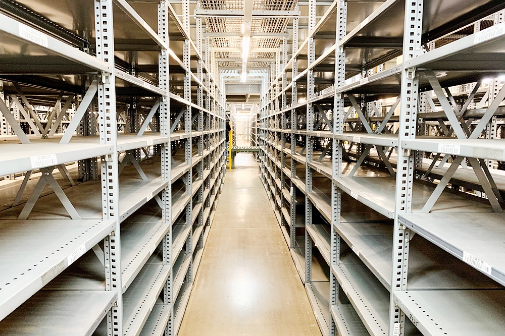 Used industrial clip steel shelving available at American Surplus. Heavy-duty metal shelving units in various depths for warehouse and distribution center storage.